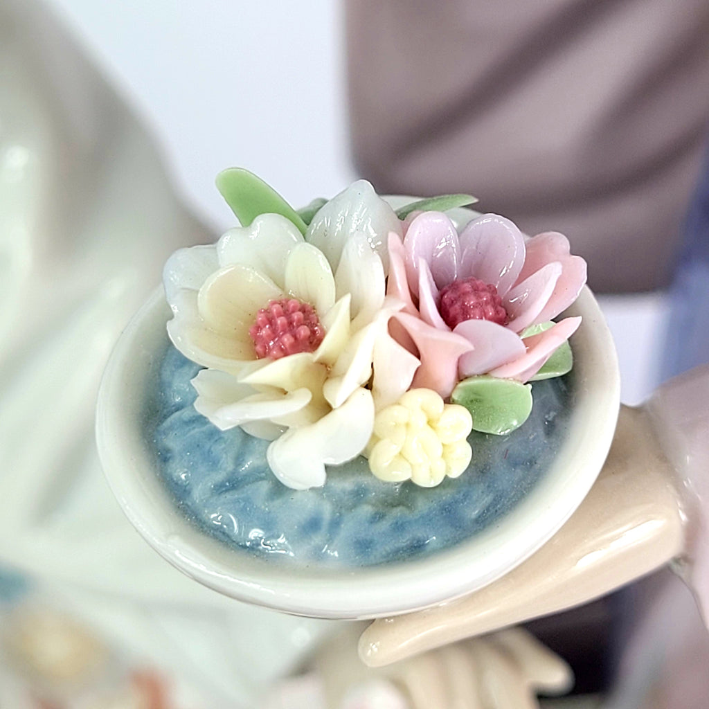 Take a Guess at What Type of Figurine This Little Bouquet Rests In?